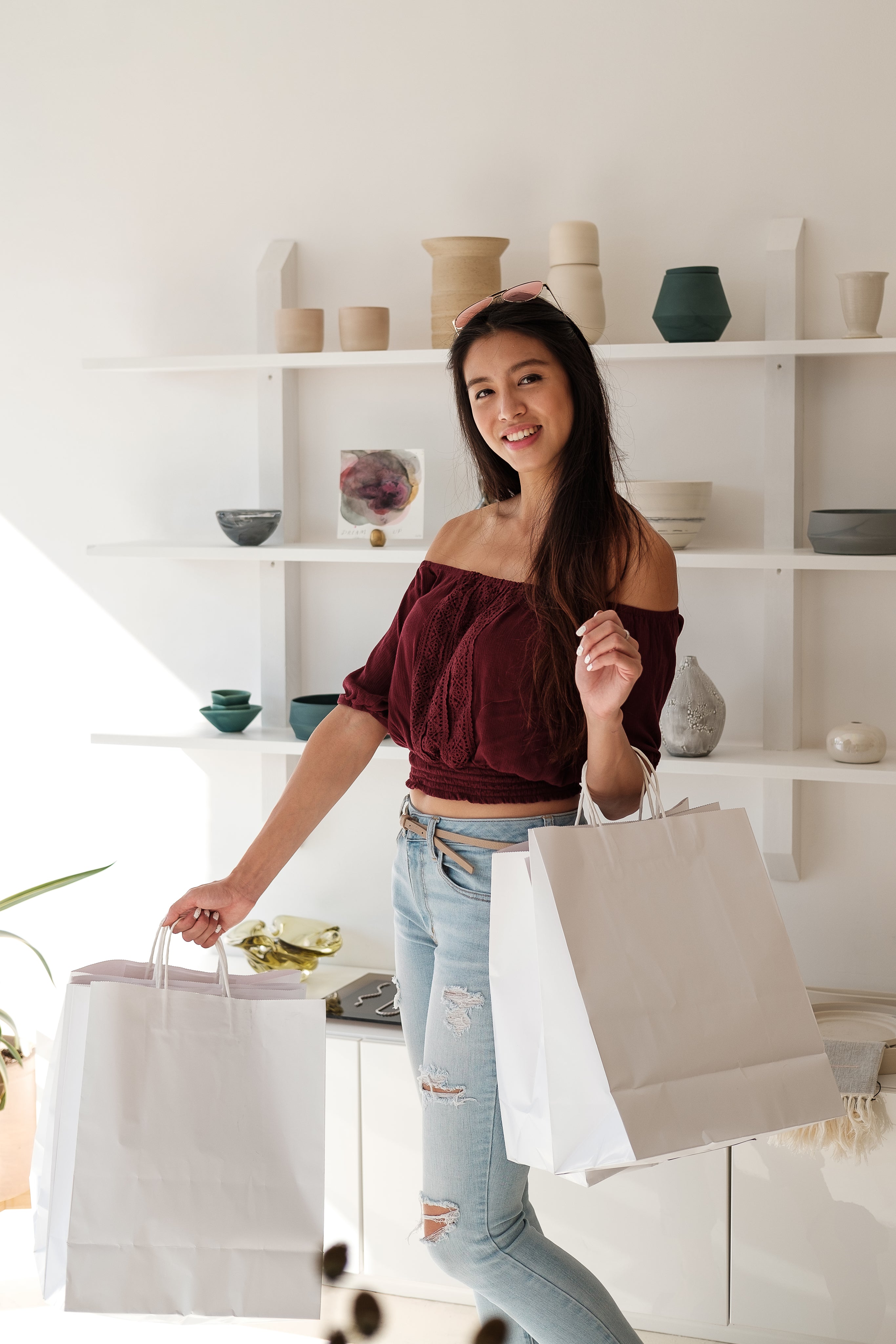 files/happy-customer-smiles-and-holds-white-shopping-bags.jpg